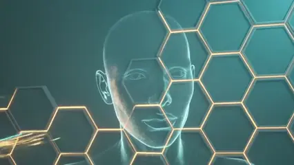 A digital human head drawn in light behind a grid of gold hexagons